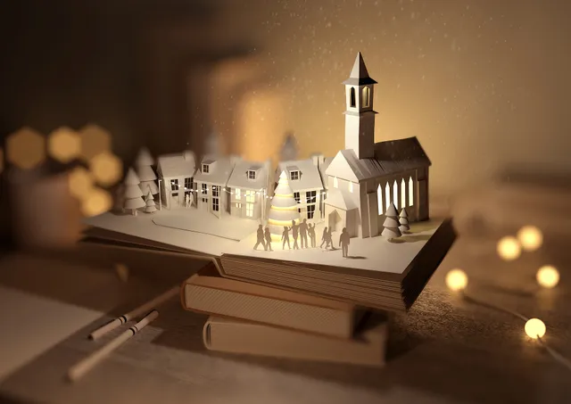 Op de opgestapelde boeken zie je miniaturen van een kerk, kerstboom en huisjes. Om de boeken heen zie je kerstlampjes.