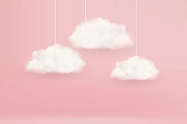 Wolken aan een draadje, met een roze achtergrond.